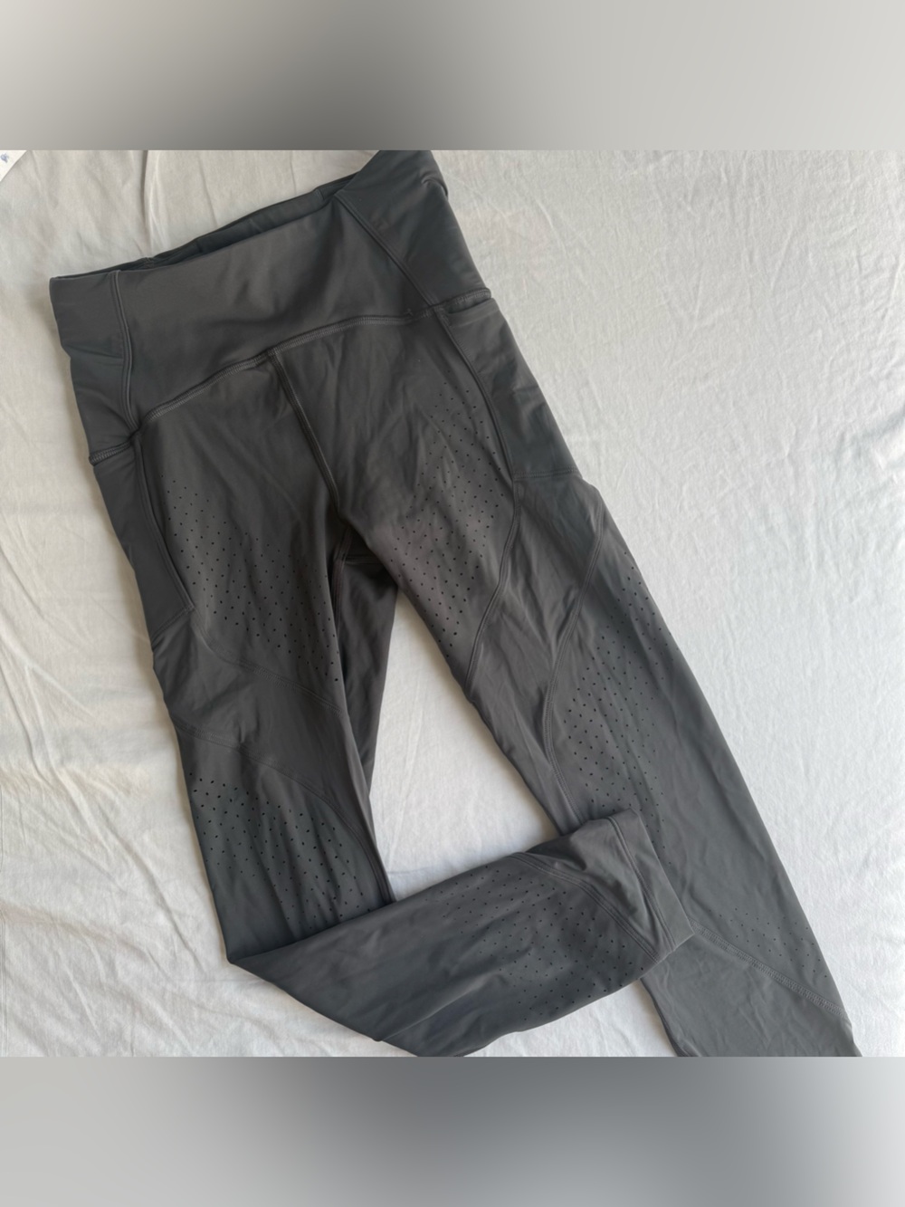 lululemon dark grey leggings size 4 with side pockets and perforated details